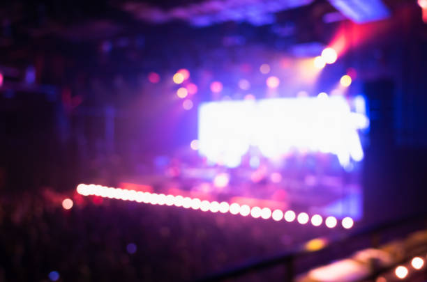 istock Blur music concert hall with purple illumination 1007845504