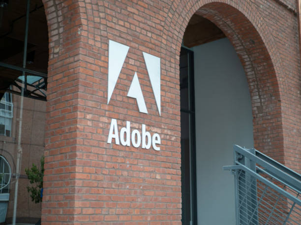 Entrance to Adobe San Francisco office location in historic Baker and Hamilton warehouse SAN FRANCISCO, CA JULY 1, 2018: Entrance to Adobe San Francisco office location in historic Baker and Hamilton warehouse adobe material stock pictures, royalty-free photos & images