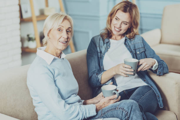 istock Attractive blonde sitting near her relative 1007849492