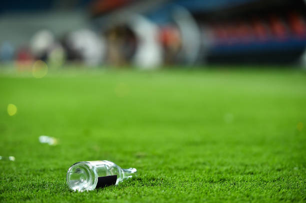 istock Plastic trash can on the turf on a soccer field 1007857296