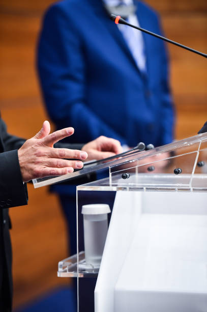 istock Detail shot with man in suits during a press conference 1007857376