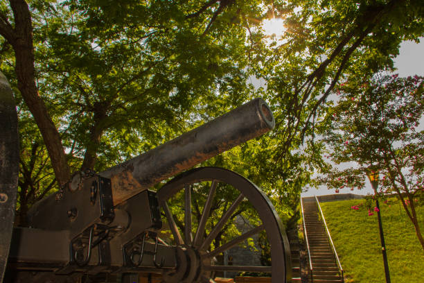 Canon at Fort Monroe A sunstar looks over a cannon at Fort Monroe, a historic public space in Hampton, Virginia. hampton virginia photos stock pictures, royalty-free photos & images