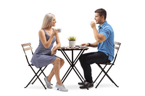 istock Young woman and a young man sitting at a coffee table 1007858118