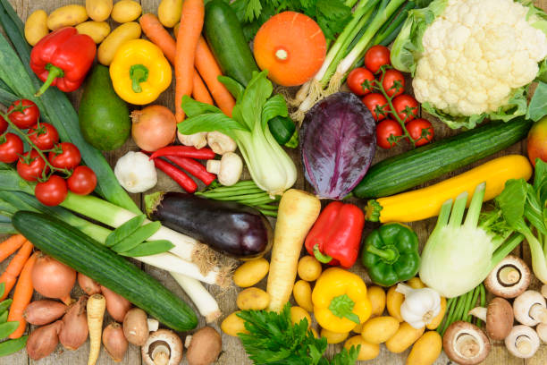 group of fresh vegetables from market - isolated on red still life tomato lemon imagens e fotografias de stock