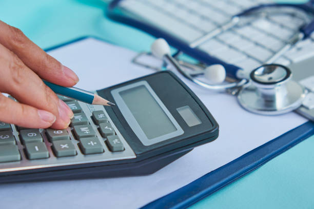 medical cost closeup calculates on an electronic calculator stock photo