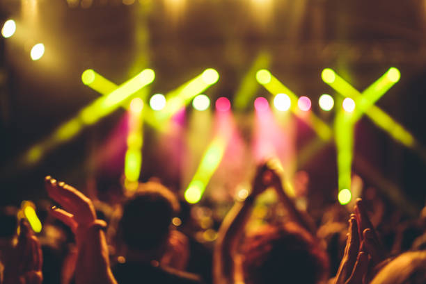 istock illuminated crowd in front of a concert stage 1007915576