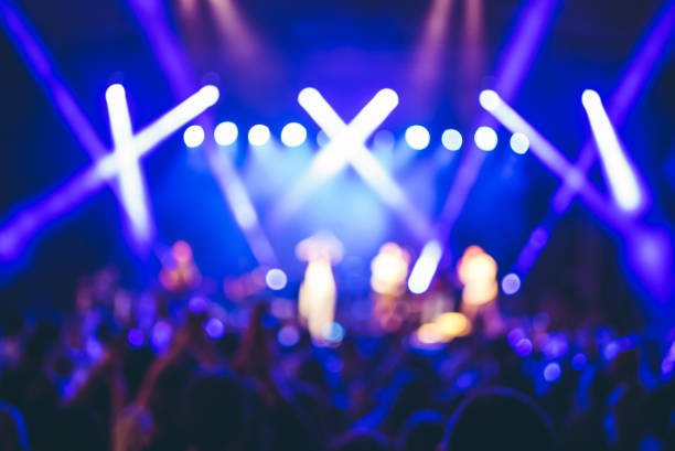 istock illuminated crowd in front of a concert stage 1007915668