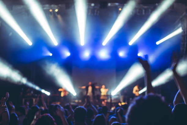 istock illuminated crowd in front of a concert stage 1007915784