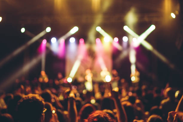 istock illuminated crowd in front of a concert stage 1007915876