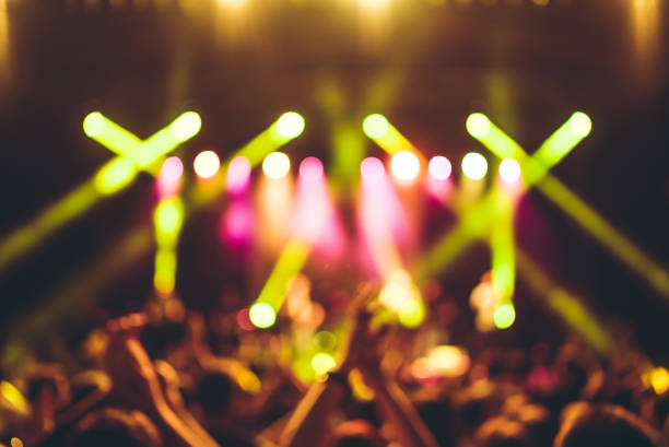 istock illuminated crowd in front of a concert stage 1007916008