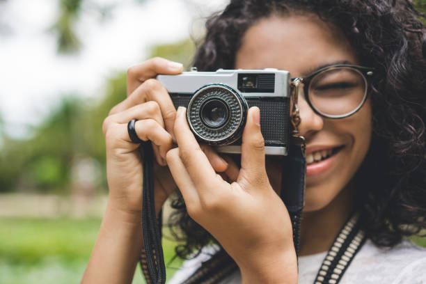 istock Girl taking photos in the public park 1007919976
