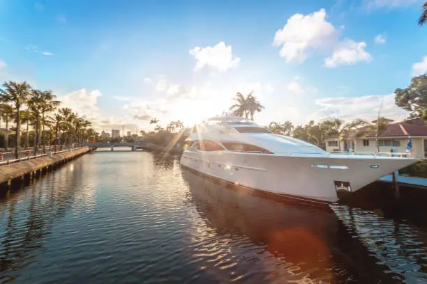 Photo of Sunset at Fort Lauderdale canals. Luxury yachts in Las Olas Boulevard, Florida, USA