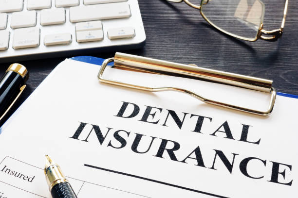 istock Dental insurance form and pen on a desk. 1007950484