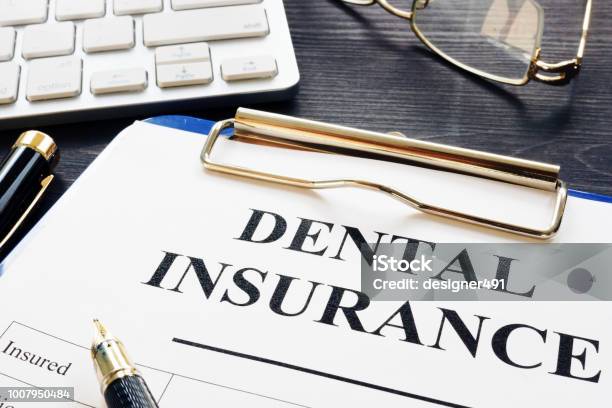 Dental Insurance Form And Pen On A Desk Stock Photo - Download Image Now - Dental Health, Insurance, Benefits