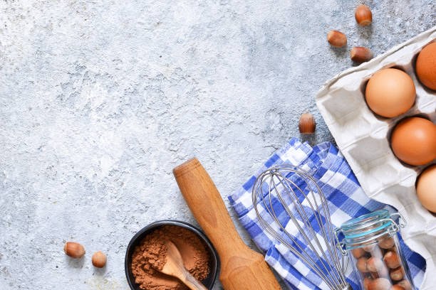 istock Food background. Ingredients for baking: flour, eggs, berries, chocolate on a concrete background. 1007951116