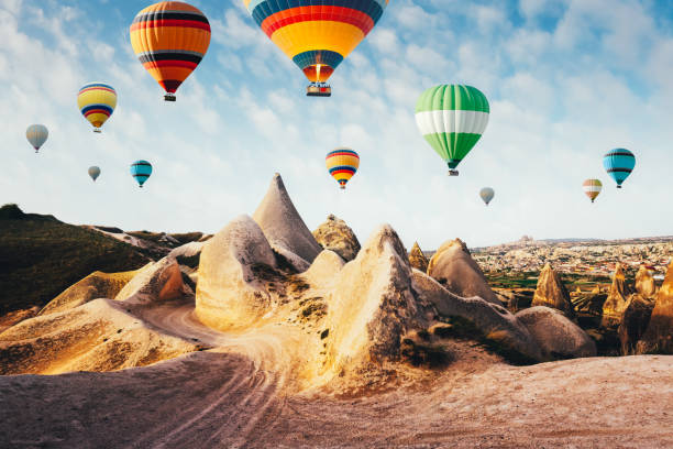 istock Color balloons in the sunrise sky 1007951542