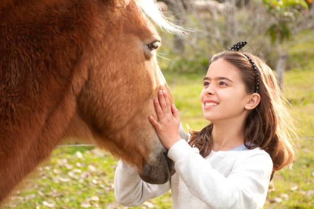 istock girl with horse 1007954160
