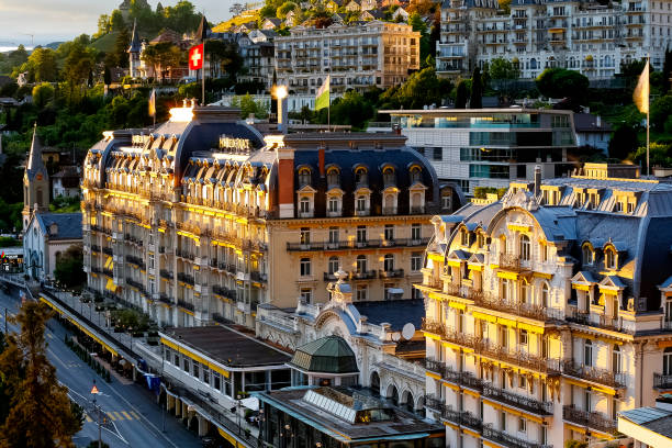 Fairmont Le Montreux Palace Hotel in the evening. The famous five-star luxury hotel was built in 1906 and offers a luxurious stay for visitors to the Swiss Riviera in Montreux. stock photo