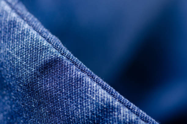 istock Blue jeans fabric macro texture fashion 1007958214