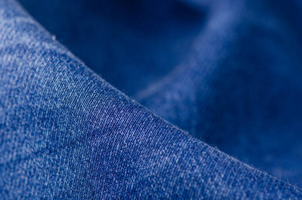 istock Blue jeans fabric macro texture fashion 1007958234