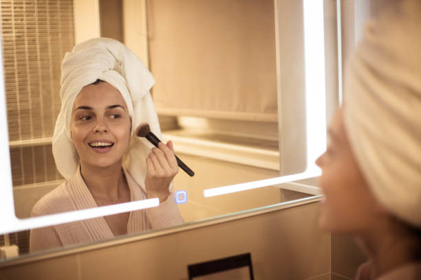 istock The woman is making up in the bathroom 1007965064