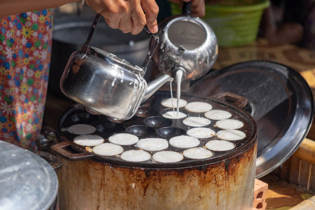 istock Making of Thai sweetmeat khanomkhrok 1007968166