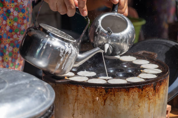 istock Making of Thai sweetmeat khanomkhrok 1007968172