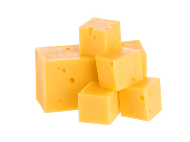 istock Heap of cheese cubes isolated on white background. With clipping path. 1007968458
