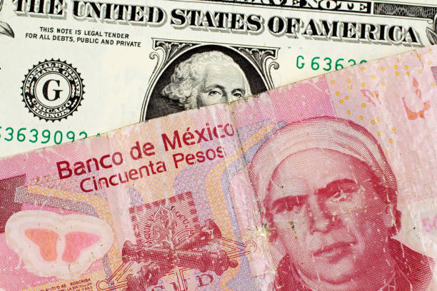 Mexican 50 Peso Note With An American One Dollar Bill stock photo