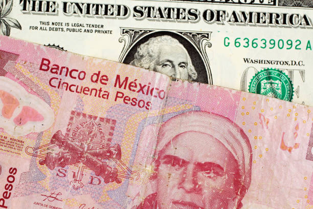 istock Mexican 50 Peso Note With An American One Dollar Bill 1007973390