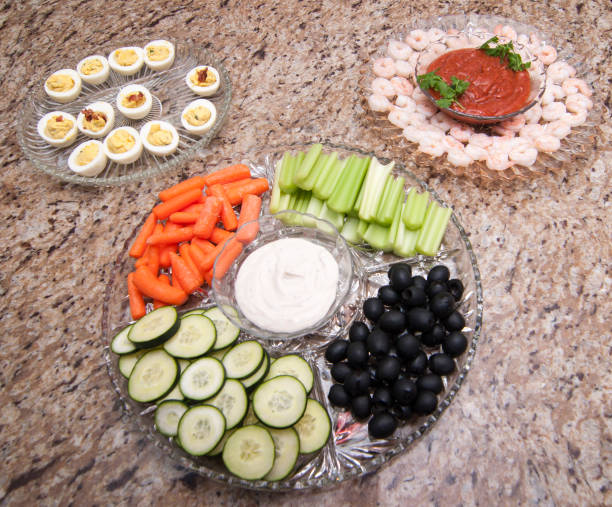 Appetizers of vegetables, shrimp and eggs stock photo