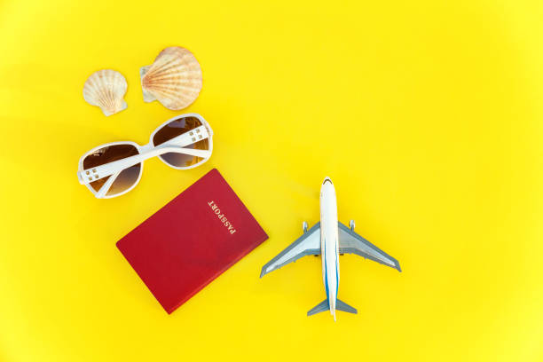 istock Concept of traveling on yellow background 1007980402