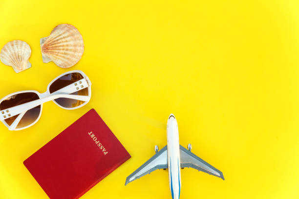 istock Concept of traveling on yellow background 1007980440