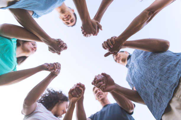 istock Family clasping hands in solidarity 1007981266