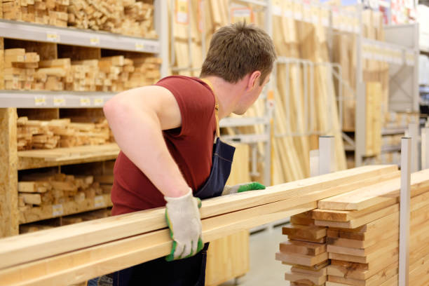istock worker or seller in construction store or warehouse wood department at work 1007987200