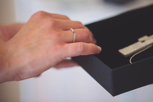 ring with precious metal and stone on a blue background