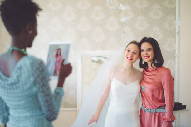 istock The bride is trying out her wedding dress 1007990400
