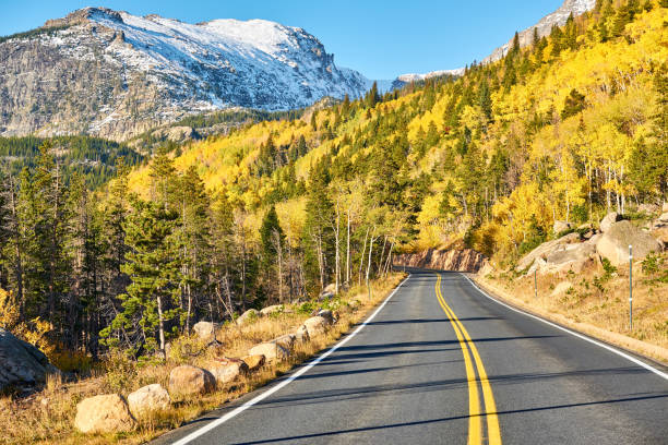 Highway at autumn in Colorado, USA. Highway at autumn sunny day in Rocky Mountain National Park. Colorado, USA. rocky mountain national park photos stock pictures, royalty-free photos & images