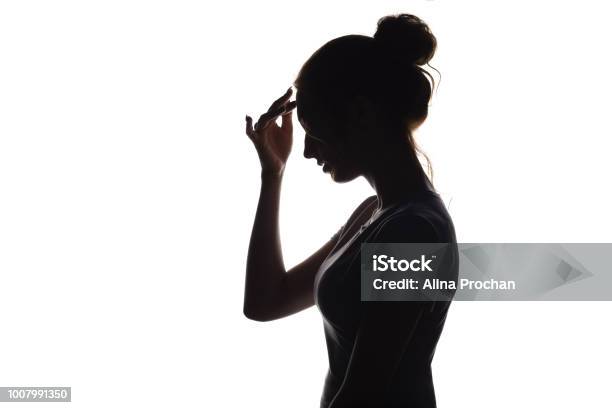 Silhouette Profile Of A Young Woman On A White Isolated Background Stock Photo - Download Image Now