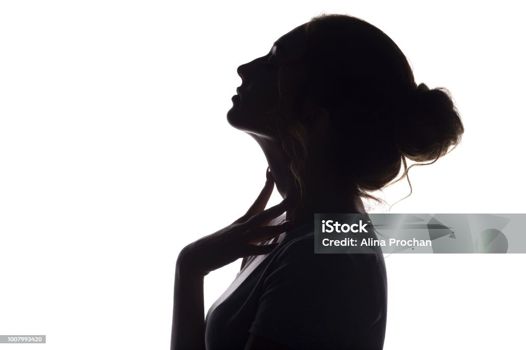 silhouette of beautiful sensual girl, woman face profilee on white isolated background, concept of beauty and fashion silhouette of beautiful sensual girl, woman face profile on white isolated background, concept of beauty and fashion Beauty Stock Photo