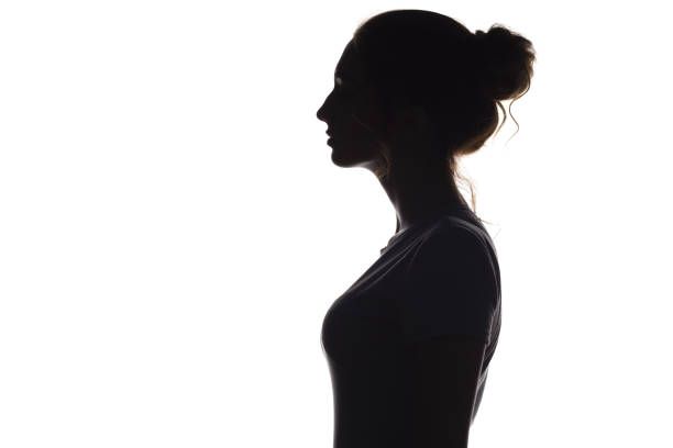 istock silhouette profile of young woman on a white isolated background 1007993432