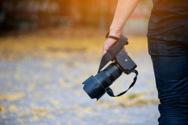 istock Hand and camera and travel 1007997188