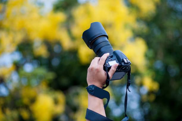 istock Hand and camera and travel 1007997208