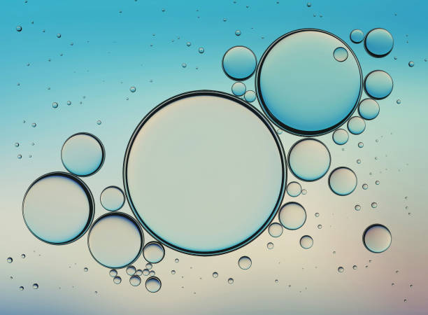 istock Oil Bubbles Isolated on White Background, Closeup Collagen Emulsion in Water. Illustration. Gold Serum Droplets 1008012012