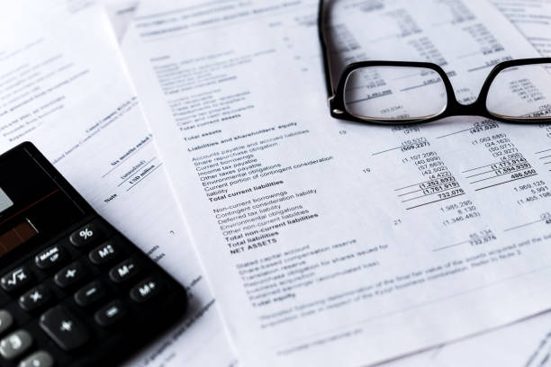 istock Calculator and financial documents or statement. Concept of financial markets. 1008012940
