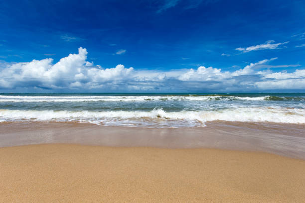 istock Sea view from tropical beach with sunny sky. Summer paradise beach 1008013104