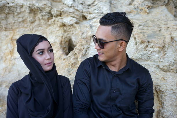 istock Couple in the mountains Rock with Black Dress 1008013116