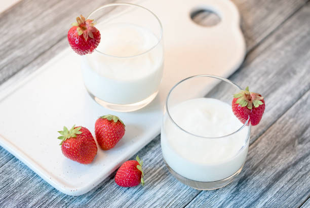 istock Yogurt with strawberry on wooden gray table. 1008013240