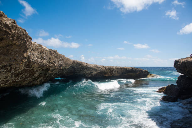 istock Waves coming through Natural Bridge at Shete Boka natural park, Curacao 1008015746