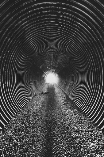 Single lane corrugated steel road tunnel.